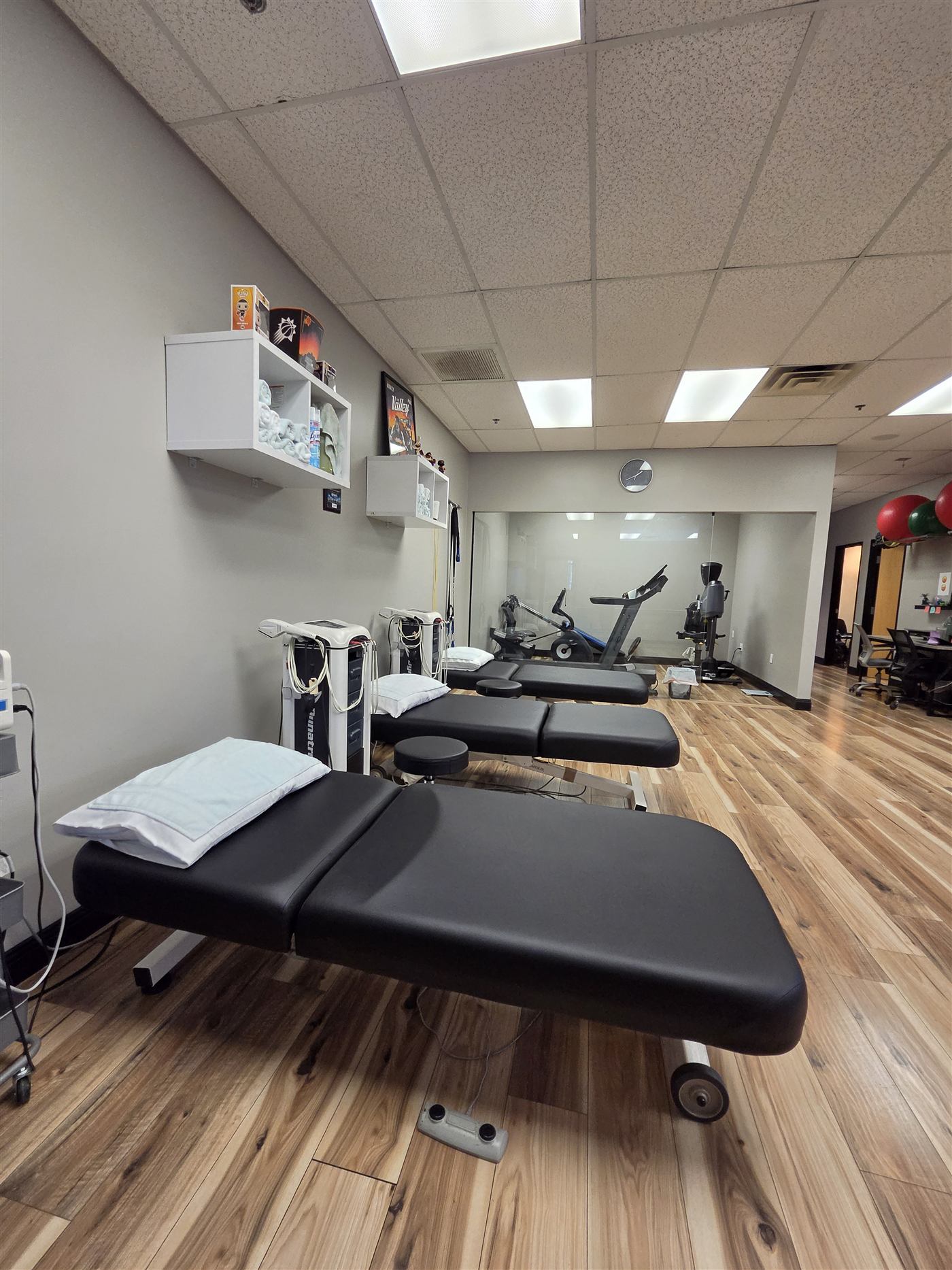 Row of treatment tables on the Synergy clinic floor